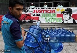 Miliitantes participan en una manifestación frente al Ministerio Público en Tegucigalpa - © Orlando SIERRA / AFP